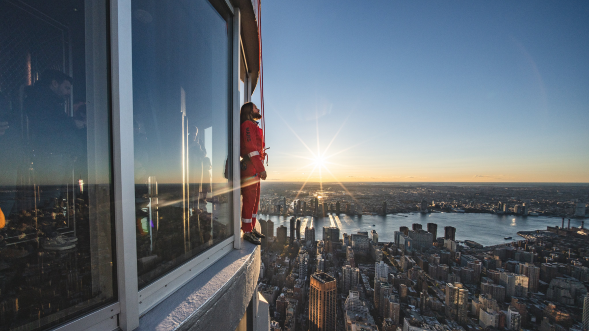 Jared Leto faces away from the Empire State Building during his ascent